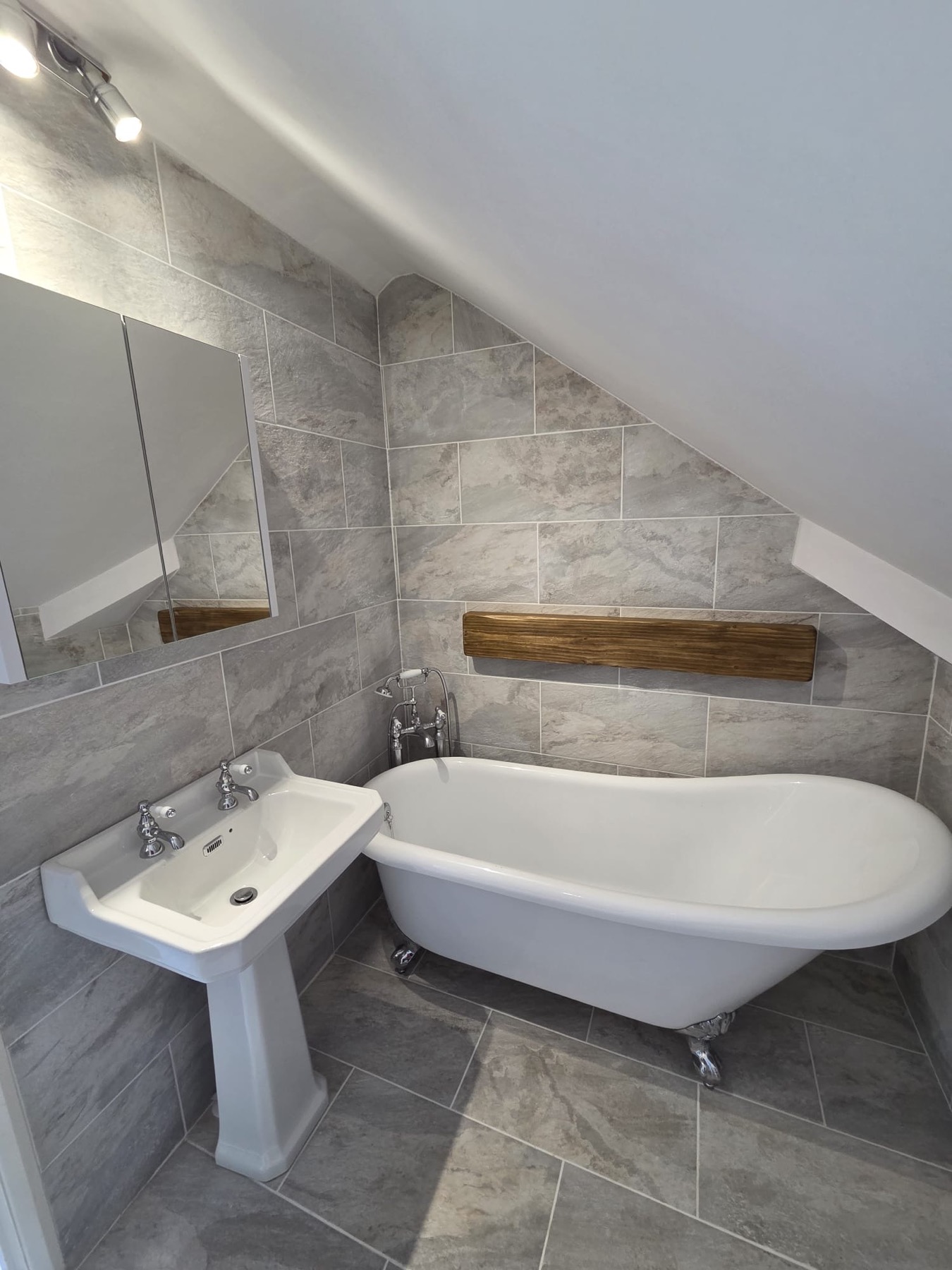 Sloped Ceiling Bathroom with Freestanding Bath