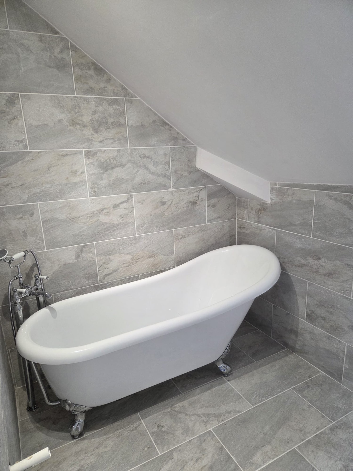 Freestanding Bath with Stone Tiles